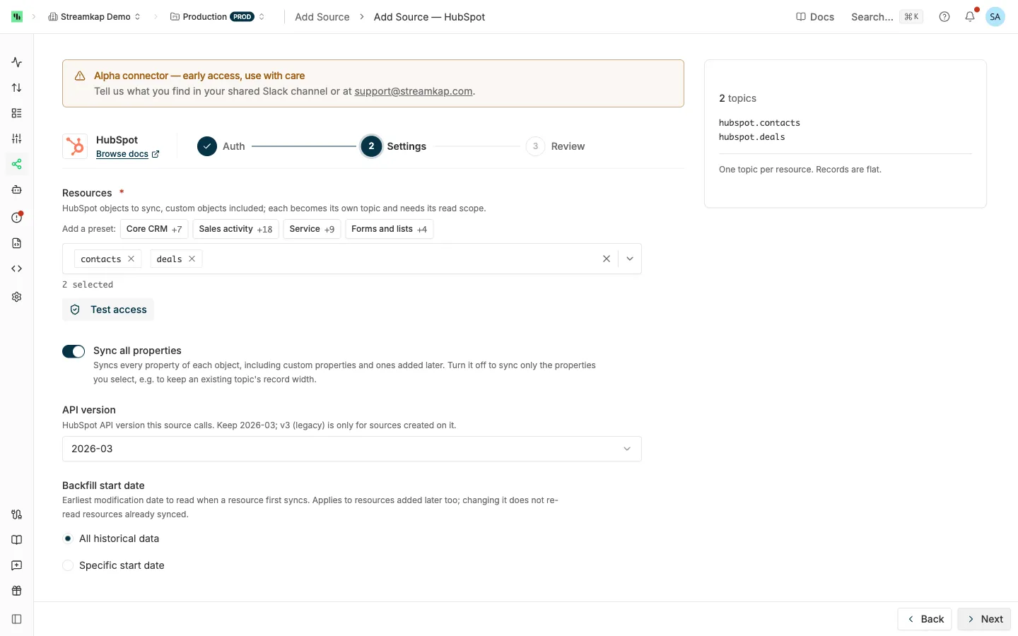 HubSpot source Settings step with the resource presets, the Resources list, Sync all properties, API version and the Backfill start date choice